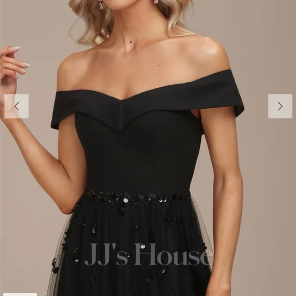 Never worn, tags in. Beautiful off-shoulder black formal gown. Unaltered.